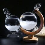 Elegant glass chemistry set with round-bottom flasks and wooden stand, perfect for educational science experiments and decorative displays.