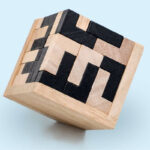 A wooden maze puzzle with black and natural wood pieces, designed for cognitive development and fun.