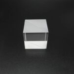 Clear glass cube mirror with sharp edges, perfect for science experiments and educational displays.