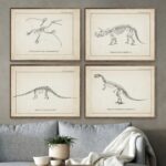 Vintage-style dinosaur skeleton illustrations framed on wall, perfect for science decor and educational display in a classroom or study.