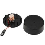 Small electromagnetic motor kit with a coil, magnet, and battery holder for educational science projects and experiments.