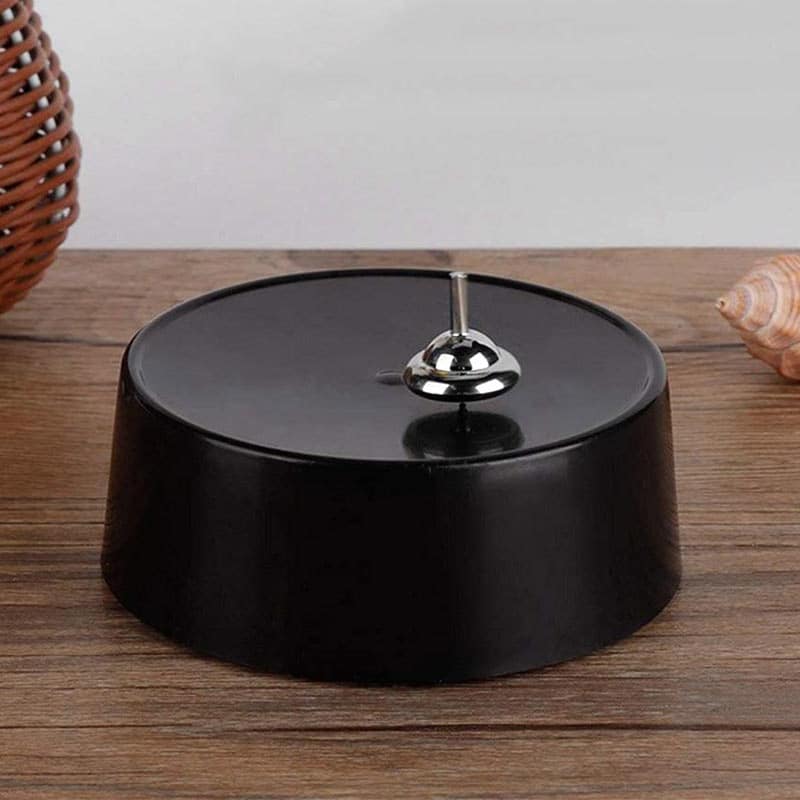 Magnetic Pendulum Science Toy A magnetic pendulum science toy with a black circular base and a metal pendulum, designed for educational and decorative purposes.