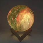 3D-printed moon lamp illuminated with realistic lunar surface details, perfect for space-themed decor and educational purposes.