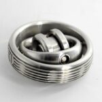 A metallic sphere gear puzzle with interlocking rings, showcasing intricate engineering and mechanical design. Perfect for science enthusiasts and educational purposes.