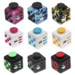 Set of nine colorful dice with various patterns including galaxy, camouflage, and solid colors, designed for educational and science decor purposes.