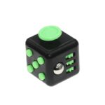 Fidget cube with black and green design, featuring buttons, switches, and a rolling ball for stress relief and sensory stimulation.