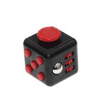 Small black cube with red buttons and a silver dial, designed as an educational puzzle toy for science and logic learning.