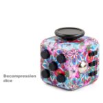 Colorful decompression dice puzzle with multiple black buttons and a metallic ball, designed for educational and recreational use.