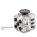 Decompression dice toy designed for stress relief, focus, and relaxation, featuring a camouflage pattern with multiple tactile buttons and a spinning top for sensory stimulation.