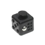 Portable electronic device with a black cube design, featuring several buttons, a large dial on top, and multiple USB ports on the side.