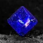 Vibrant blue glitter cube with sparkling reflective surfaces, perfect for science-themed decor or educational demonstrations.