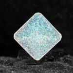 Iridescent diamond-shaped holographic science toy with shimmering surface, perfect for educational science experiments and decorative displays.