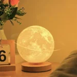 Realistic moon-shaped LED lamp with detailed lunar surface, perfect for bedroom decor, night lighting, or educational purposes.