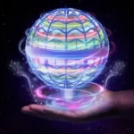 Futuristic holographic globe with colorful neon lines floating above a hand in space background.