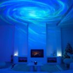 Ceiling projection of a swirling starry sky with blue and green hues illuminating a modern living room.