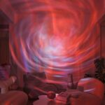 A mesmerizing light projection resembling a swirling galaxy or nebula on the living room wall, creating a captivating cosmic ambiance.