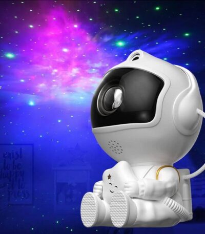 A cute astronaut-themed night light designed for children, featuring a space robot with colorful LED lights projecting starry patterns on the wall.