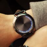 LED digital smartwatch with customizable display and touch controls.