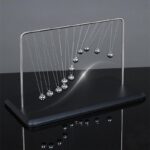 Classic Newton's Cradle with metal balls demonstrating conservation of momentum and energy, perfect for science classrooms and educational displays.