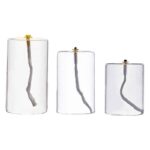 Set of three candles with wicks shaped like firework explosions, perfect for science-themed decor and educational displays.