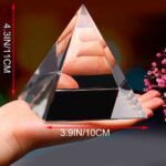 Reflective pyramid crystal paperweight, 4.3 inches tall and 3.9 inches wide, ideal for desk decor or educational displays.