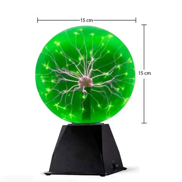 Illuminated plasma globe with electric filaments inside a green glass sphere, 15 cm in diameter, mounted on a black base, ideal for science decor and educational displays.