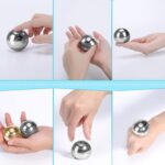 Hand holding a shiny metal magnetic sphere, demonstrating magnetic attraction and repulsion. Perfect for educational science toys and decor.