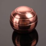 Copper sphere with concentric grooves, ideal for science experiments, decor, and educational toys.