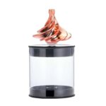 A mesmerizing magnetic liquid sculpture floating above a transparent display case, showcasing swirling metallic colors and dynamic movement.