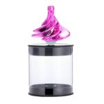 A vibrant pink magnetic liquid sculpture floating inside a clear display case, showcasing mesmerizing swirling patterns and dynamic movement.