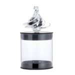 A transparent vortex bottle with a swirling silver liquid inside, demonstrating fluid dynamics and vortex formation.