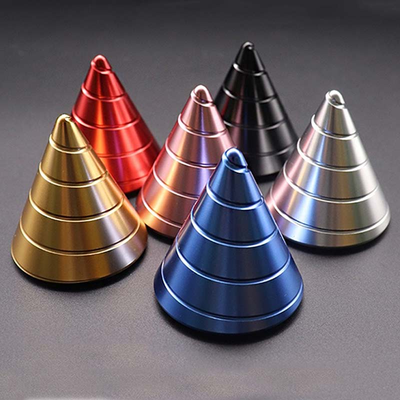 Colorful metallic cone stacking toys for science education and decor. Brightly colored metallic cones in red, gold, pink, black, silver, and blue arranged in a pyramid shape.