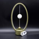 Modern light therapy lamp with adjustable stand, white spherical light, and power cord, designed for relaxation and mood enhancement.