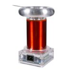Small Tesla coil model used for educational science demonstrations, featuring a transparent base and copper coil, illustrating electromagnetic principles.