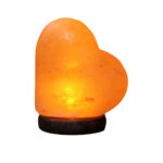 Heart-shaped Himalayan salt lamp emitting a warm, soothing glow, perfect for home decor and relaxation. Crafted from natural salt crystals, it adds a calming ambiance to any space.