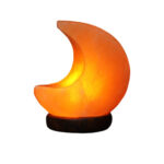 Orange crescent moon-shaped lamp with a glowing effect, resting on a black base, ideal for home decor and educational purposes.
