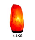 Himalayan salt lamp emitting warm orange glow, weighing 4-6kg, perfect for home decor and creating a relaxing atmosphere.