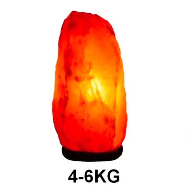 Himalayan salt lamp emitting warm orange glow, weighing 4-6kg, perfect for home decor and creating a relaxing atmosphere.