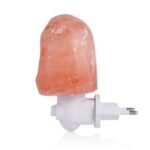 Salt lamp night light with Himalayan salt crystal and white plug-in base. Perfect for creating a relaxing ambiance and adding a natural decorative touch to any room.