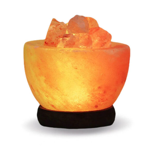 Himalayan salt lamp with glowing rock salt crystals, providing ambient lighting and natural air purification for home or office decor.