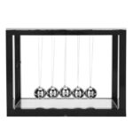 Classic Newton's Cradle with five shiny metal balls in a black frame, demonstrating momentum and energy transfer for educational and decorative purposes.