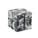 Marble run puzzle cube with black and white marbled design, featuring magnetic pieces that can be assembled into various shapes for educational and entertainment purposes.