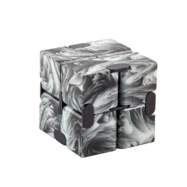 Marble run puzzle cube with black and white marbled design, featuring magnetic pieces that can be assembled into various shapes for educational and entertainment purposes.