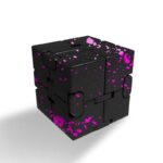 Black Rubik's Cube with vibrant pink paint splatter pattern, showcasing a modern and artistic twist on a classic puzzle toy.