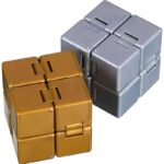 Two magnetic puzzle cubes, one gold and one silver, with interlocking pieces designed for educational and brain-teasing fun. Perfect for science and STEM learning activities.