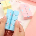 Bright pastel blue, pink, and yellow magnetic blocks designed for children to build and explore.