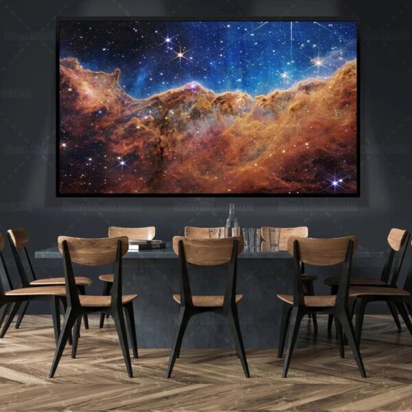 Large screen showing a vibrant image of a cosmic nebula with stars, set in a modern conference room with wooden chairs and a dark wall background.