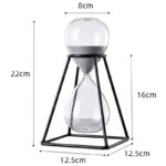 Sand timer with a sleek metal frame, measuring 22cm in height and 8cm in diameter, featuring a glass hourglass with white sand for precise time measurement.