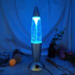 Modern lava lamp with blue lightning effect, creating a calming and mesmerizing glow, perfect for science decor and educational spaces.