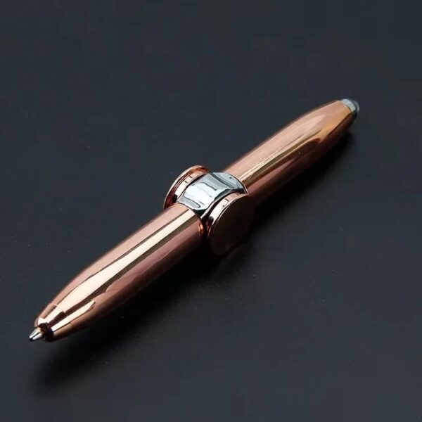 Close-up of a sleek rose gold ballpoint pen with silver accents on a dark background, showcasing its modern design and polished finish.